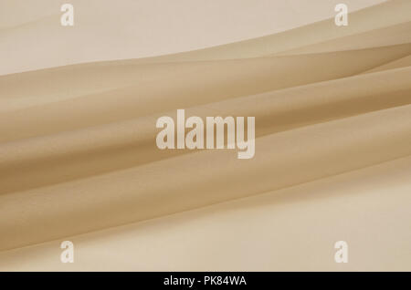 Silk fabric, beige organza. Stock Photo