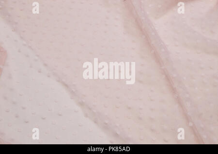 Polyamide fabric with polka dots light pink with elastane. Stock Photo