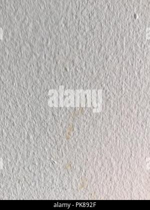 Textured white painted wall with textures. Stock Photo