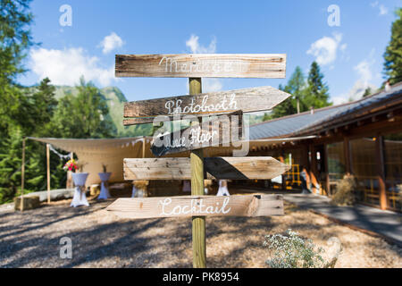 Outdoor Wooden Photo Booth Direction Sign at Shabby Chic Wedding Stock Photo