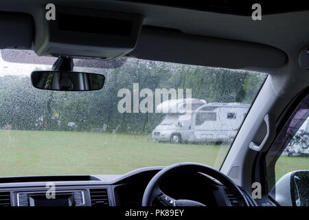 Campervan on a campsite in the rain Stock Photo