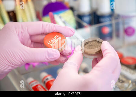 Eyebrow master in a beauty salon prepares materials for work Stock Photo