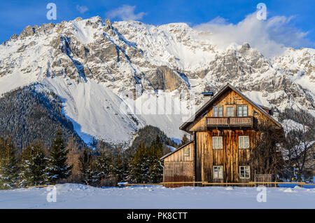 lonely hut in the alps with snow Stock Photo
