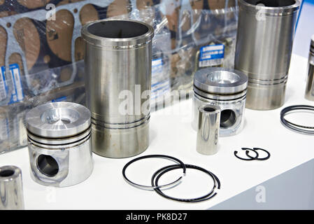 Engine spare parts: pistons, rings and cylinder liners in store Stock Photo