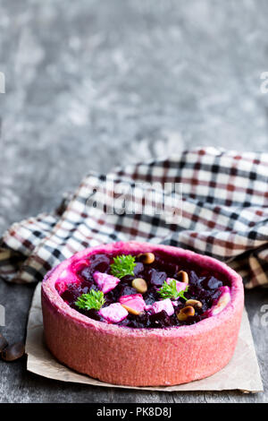 Homemade  balsamic beetroot and goat's cheese quiche on wooden table Stock Photo