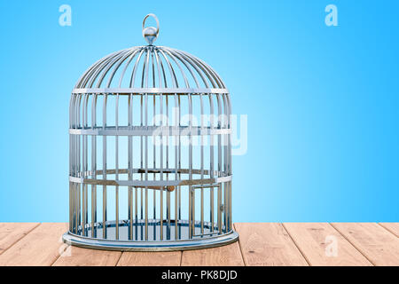 Bird cage on the wooden table. 3D rendering Stock Photo