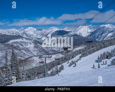 Wildwood Epress Lift 3 with the Gore Range in the background, Hunky Dory ski trail, winter, Vail Ski Resort, Vail, Colorado. Stock Photo