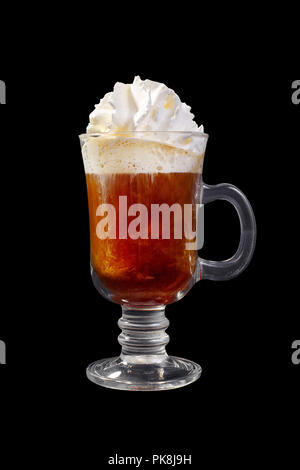 Brown opaque cocktail, coffee without milk, hot chocolate in a tall glass with a handle with whipped cream. Side view. Isolated black background. Drin Stock Photo