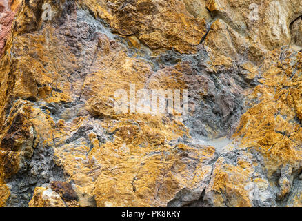 Copper ore deposits in rocks at Parys Mountain Copper Mine, Anglesey, Wales Stock Photo