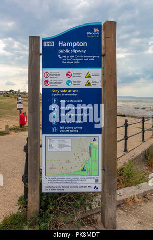 Warning and Information signs on the public boat slipway at Hampton, Herne Bay, Kent, UK Stock Photo