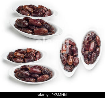 Bowl of dates isolated on white background, Set of Dates fruit shot in different angles, Clipping path included Stock Photo