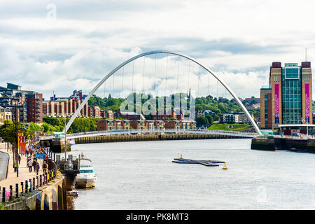 NEWCASTLE UPON TYNE, United Kingdom - August 27 2018: The Gateshead Millennium Bridge, pedestrian and cyclist tilt bridge spanning the River Stock Photo