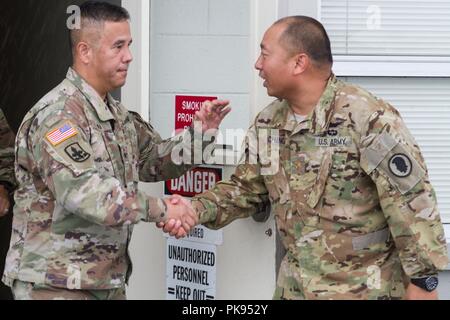 Brig. Gen. Kenneth Hara, Deputy Adjutant General, Hawaii Army National Guard and Joint Task Force 5-0 commander, lands at Hilo International Airport, Hilo, Hawaii, to conduct briefings to Hawaii National Guard and Active Duty Soldiers responding to Hurricane Lane on Aug. 27, 2018, August 27, 2018. Local authorities and the state of Hawaii, through JTF 5-0, requested HH-60M Black Hawk helicopters with hoist capability to assist local authorities with recovery operations on the Isle of Hawaii. JTF 5-0 is a joint task force led by a dual status commander that is established to respond to the effe Stock Photo