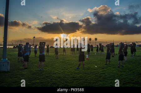 180813-N-NT795-792 CORONADO, Calif. (August 13, 2018) Chief petty officers (CPO)and CPO selectees assigned to Coastal Riverine Group (CRG) 1 conduct physical training as part of CPO initiation onboard Naval Amphibious Base Coronado, August 13, 2018. CPO initiation is a professional education and training environment that starts when the announcement message is released, and time-honored tradition focused on the team/individuals as leaders of integrity, accountability, initiative and toughness. (U.S. Navy photo by Chief Boatswain's Mate Nelson Doromal Jr/Released). () Stock Photo