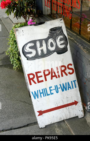 Sandwich board sign outside an old-fashioned shoe repair shop in Kerrisdale, Vancouver, BC, Canada Stock Photo