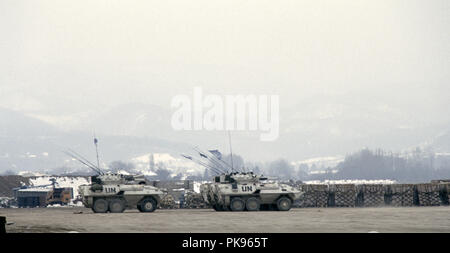 8th March 1993 During the Siege of Sarajevo: four Canadian Cougar ARVs (Armoured Reconnaissance Vehicles) parked east of the terminal building at Sarajevo Airport. The hills in the background are Serb territory. Stock Photo