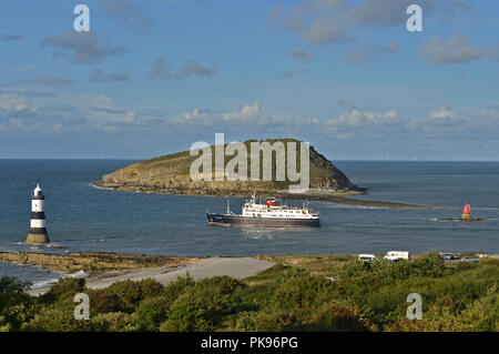 Hebridean Princess passing through the narrow channel between the island of Anglesey and Puffin Island at Penmon Point Stock Photo