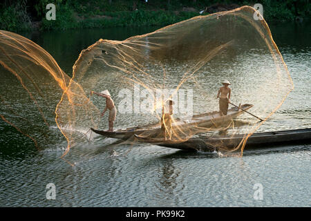 Fishermen throw fishing net on boats to catch fish Photograph by Binh Ho  Ngoc - Fine Art America