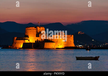 Night view of Bourtzi Castle in the Aegean Sea, Nafplio, Greece Stock Photo