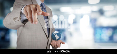 businessman workimg on VR blank wide touch screen computer on office blur background. Stock Photo