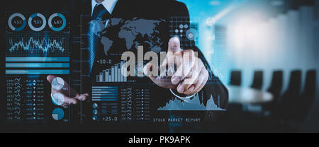 Investor analyzing stock market report and financial dashboard with business intelligence (BI), with key performance indicators (KPI).businessman hand Stock Photo