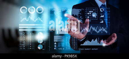 Investor analyzing stock market report and financial dashboard with business intelligence (BI), with key performance indicators (KPI).businessman hand Stock Photo
