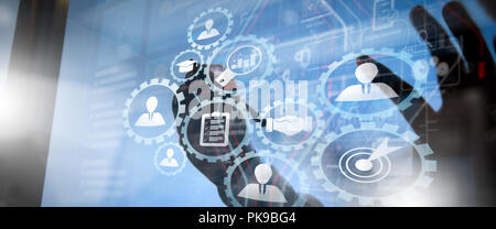 Human resources management with recruitment business working concept. HR manager is selecting candidate for hiring with virtual screen computer. Stock Photo