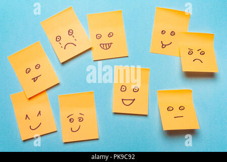 Funny stickers, notes with a smile on a blue background.Positive Attitude and Happy Concept Stock Photo