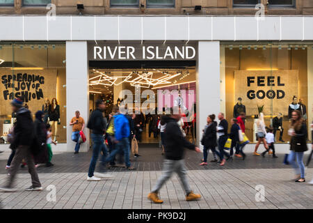 People walking past a River Island store in Church St Liverpool UK. Stock Photo