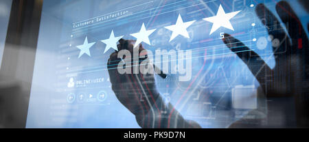 Five stars (5) rating with a businessman is touching virtual computer screen.For positive customer feedback and review with excellent performance. Stock Photo