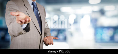 businessman working on VR blank wide touch screen computer on office blur background. Stock Photo