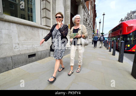 Two middle-aged women in Whitehall, central London, England, UK. Stock Photo