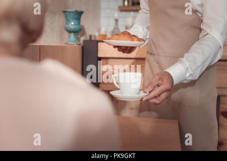 Cup of coffee being served in the cafeteria Stock Photo