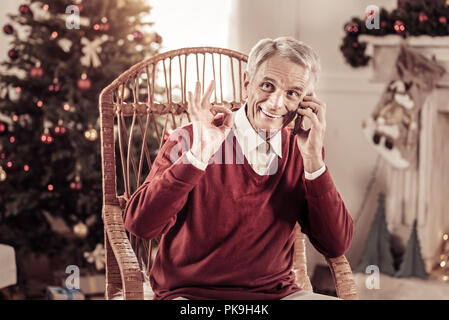 Pleasant aged man having conversation and gesticulating. Stock Photo