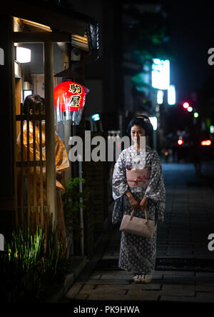 Portrait of a maiko called Chikasaya in front of her okiya, Kansai region, Kyoto, Japan Stock Photo