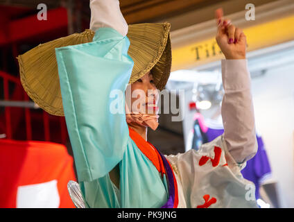 Japanese woman with straw hat during the Koenji Awaodori dance summer street festival, Kanto region, Tokyo, Japan Stock Photo