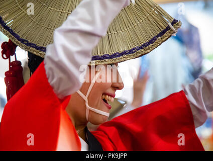 Japanese woman with straw hat during the Koenji Awaodori dance summer street festival, Kanto region, Tokyo, Japan Stock Photo