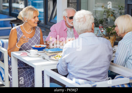 Nice aged people having dinner in the restaurant Stock Photo