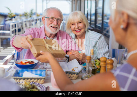Delighted nice aged people having a celebration Stock Photo