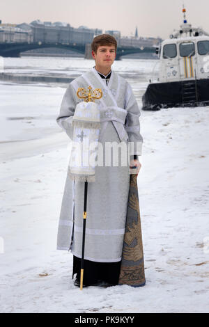 Saint Petersburg. Russia - January 12, 2018 Young churchman on the street on Epiphany day. Stock Photo