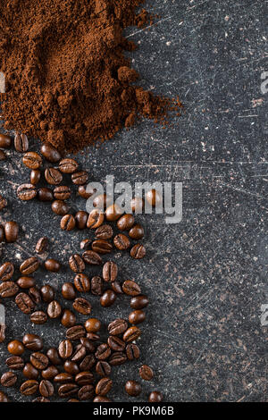 Roasted coffee beans and ground coffee beans. Stock Photo