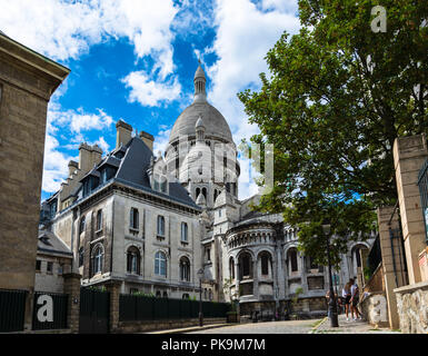sacre-coeur limestone Cathedral montmarte , paris,france during sunnyday with green conopy and compound forming natural frame Stock Photo