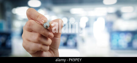Woman hand workimg on VR blank wide touch screen computer on office blur background. Stock Photo