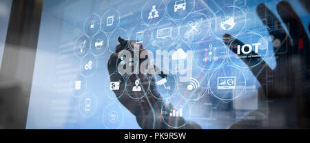 Internet of Things (IOT) technology with AR (Augmented Reality) on VR dashboard.businessman hand writing in the whiteboard or virtual screen Stock Photo