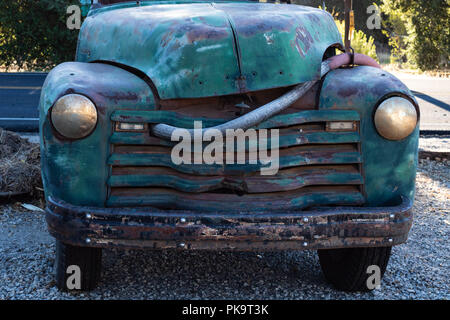 Vintage really old blue, green turquoise truck parked by the highway Stock Photo