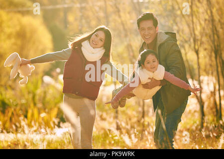 Happy families play outdoors Stock Photo