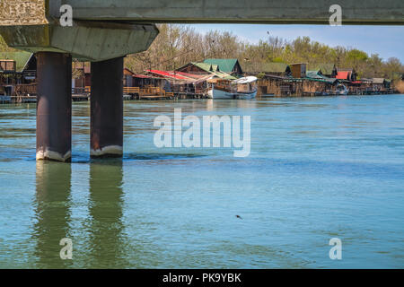 Small wooden houses and restaurants on the riverbank  of the Ada Bojana river near Ulcinj, Montenegro Stock Photo