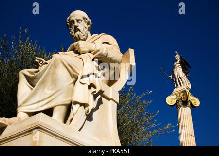 The statues of the ancient Greek philosopher Plato and Greek Goddess Athena outside of the Academy of Athens, Athens, Greece. Stock Photo