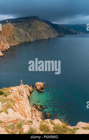 Vertical view of the bay, mountains and dramatic sky before the rain Stock Photo