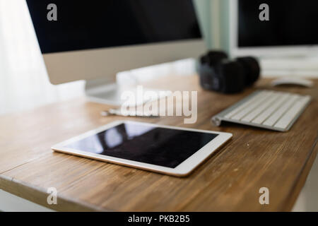 Picture of office desk with tablet computer and other accessories Stock Photo